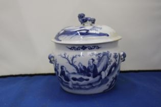 AN ORIENTAL BLUE AND WHITE LIDDED POT WITH FOO DOG LID