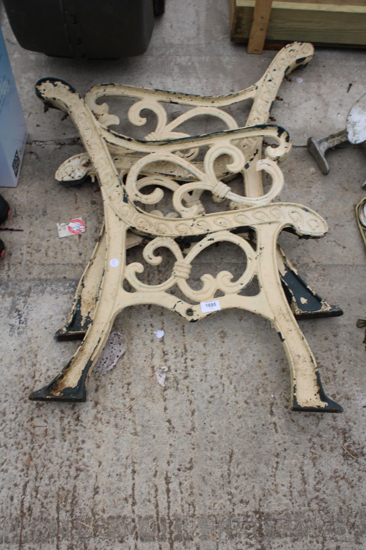 A PAIR OF DECORATIVE CAST BENCH ENDS