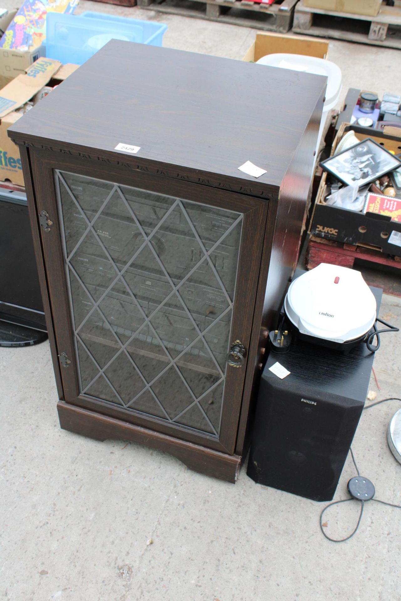 A RECORD CABINET WITH AN ASSORTMENT OF PHILIPS STEREO ITEMS