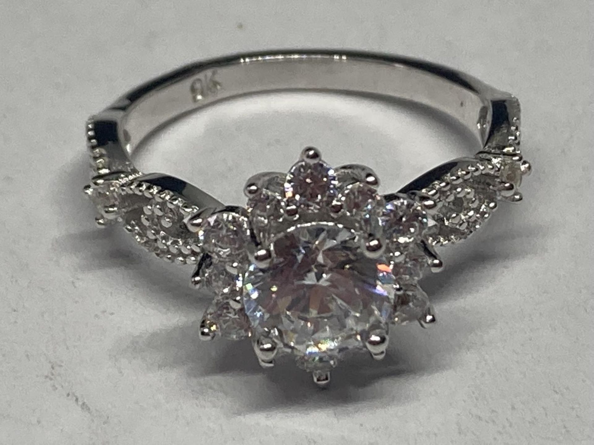 A MARKED 9K RING WITH 1 CARAT OF MOISSANITE SIZE N GROSS WEIGHT 3.05 GRAMS