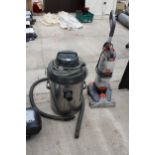A STORK INDUSTRIAL VACUUM CLEANER AND A VAX CARPET CLEANER