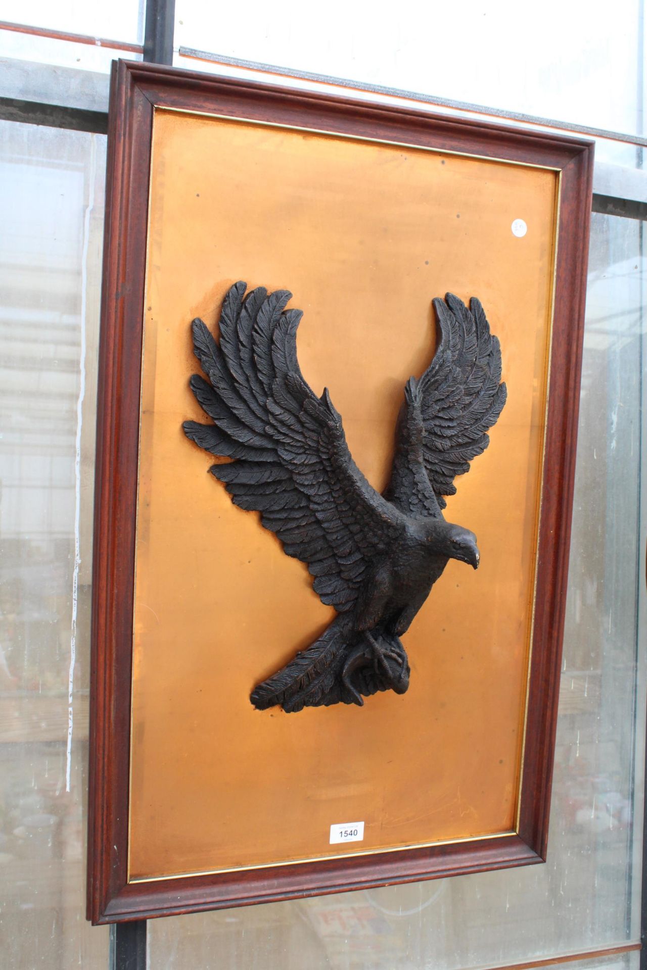 A WOODEN FRAMED 3D EAGLE WALL PLAQUE