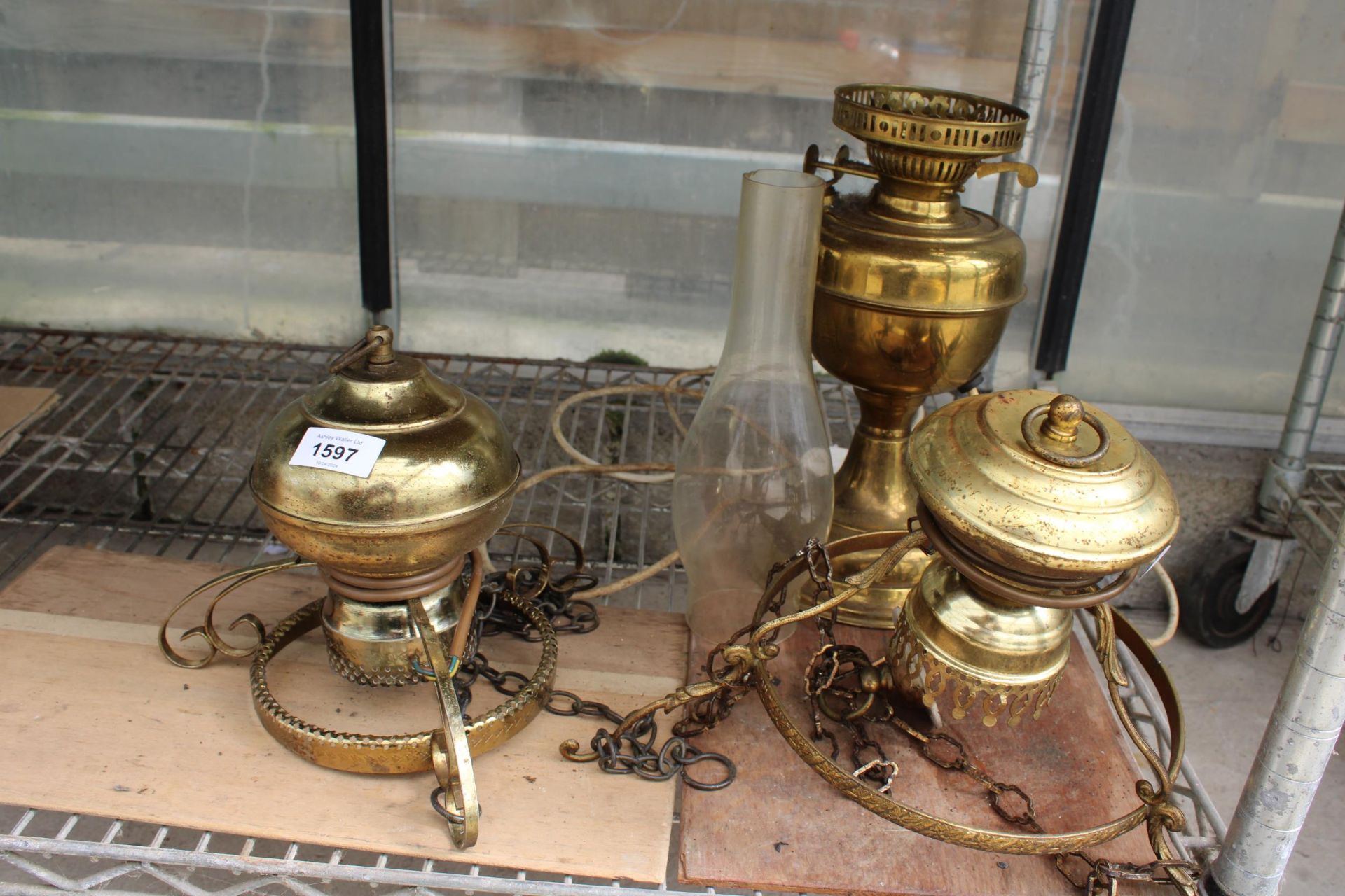 A VINTAGE BRASS OIL LAMP CONVERTED TO ELECTRIC AND TWO BRASS CEILING LIGHTS