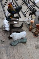 THREE CAST IRON ANIMAL DOORSTOPS AND TWO VINTAGE COBBLERS LASTS