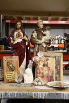 A COLLECTION OF RELIGIOUS ITEMS TO INCLUE A LARGE FIGURE OF JESUS - HAND MISSING, A MONK HOLDING A