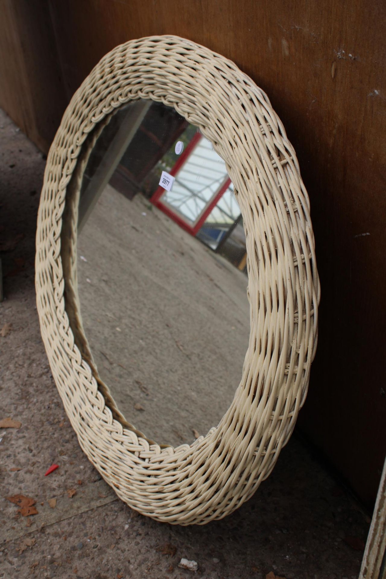 A MODERN OVAL WICKER FRAMED WALL MIRROR, 34" X 27" - Image 2 of 2