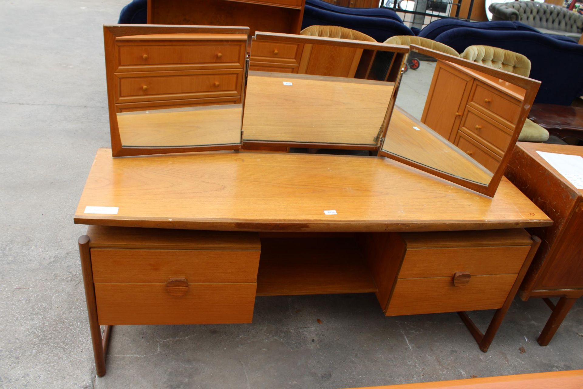 A RETRO TEAK TWIN PEDESTAL DRESSING TABLE ENCLOSING FOUR DRAWERS WITH TRIPLE MIRROR 61" WIDE