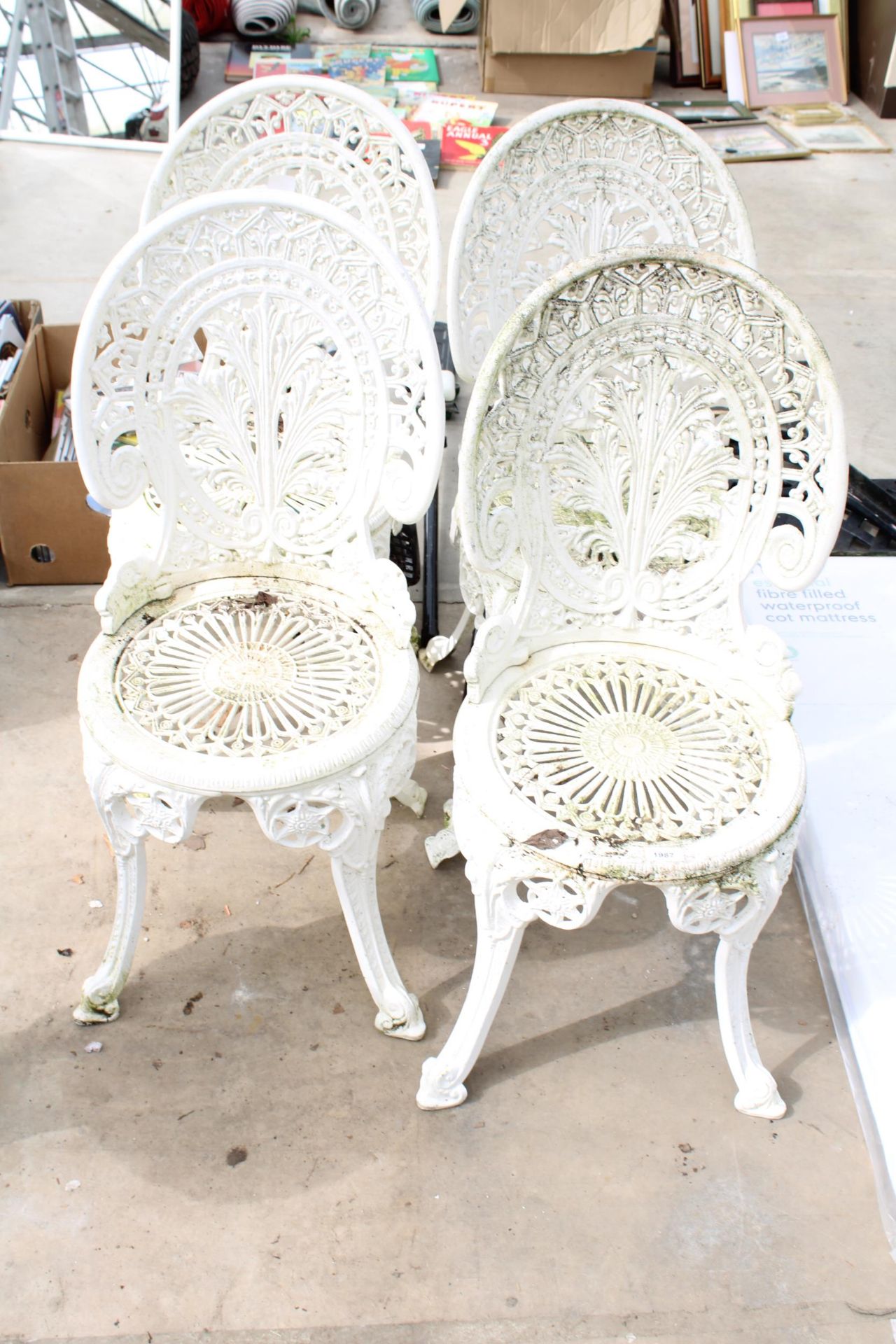 A SET OF FOUR WHITE CAST ALLOY BISTRO CHAIRS
