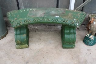 A GREEN PAINTED CONCRETE GARDEN BENCH WITH PEDESTAL BASE