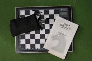 A COMET CHALLENGE CHESS COMPUTER WITH MANUAL