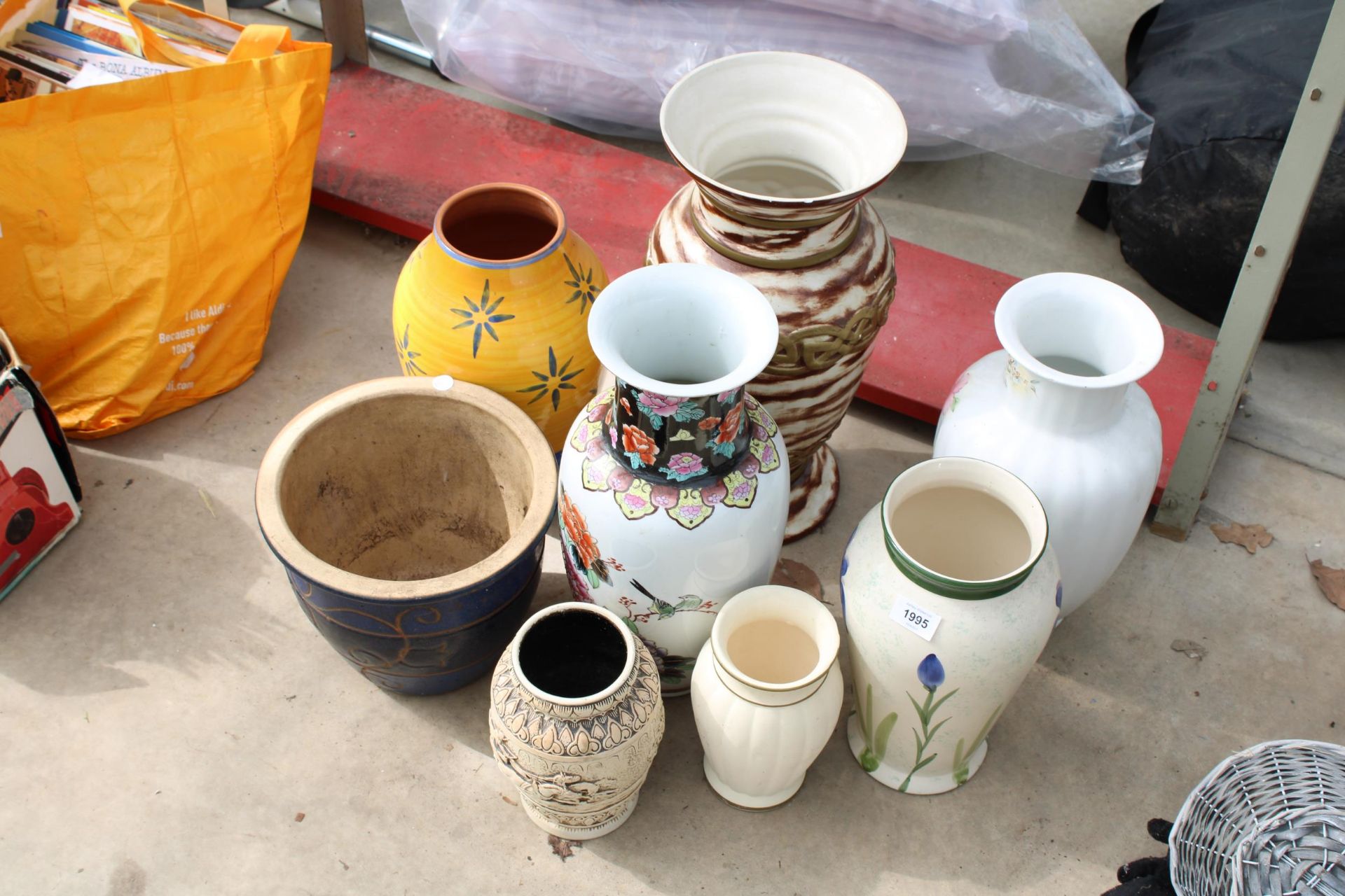 AN ASSORTMENT OF GLAZED AND CERAMIC VASES AND PLANTERS ETC