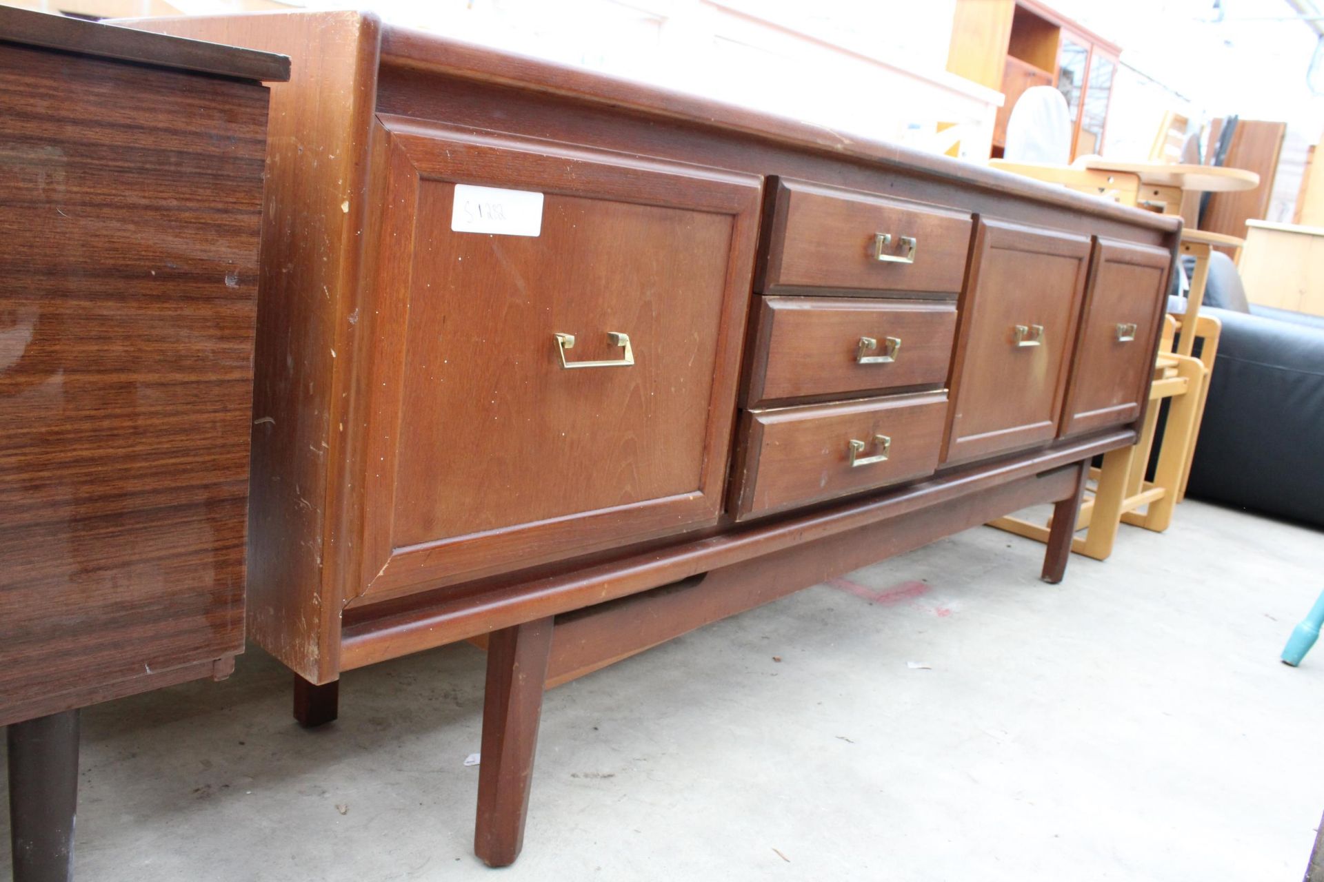 A RETRO TEAK SIDEBOARD ENCLOSING THREE DRAWERS AND THREE CUPBOARDS, 78" WIDE - Image 2 of 3