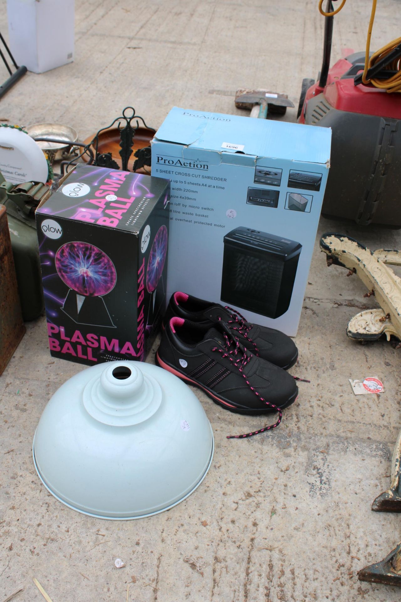 AN ASSORTMENT OF ITEMS TO INCLUDE TRAINERS, A PLASMA BALL AND A PAPER SHREDDER ETC
