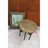 AN INDIAN STYLE BRASS TOP 23.5" SIDE TABLE ON FOLDING BASE WITH EMBOSSED BRASS FIRE GUARD