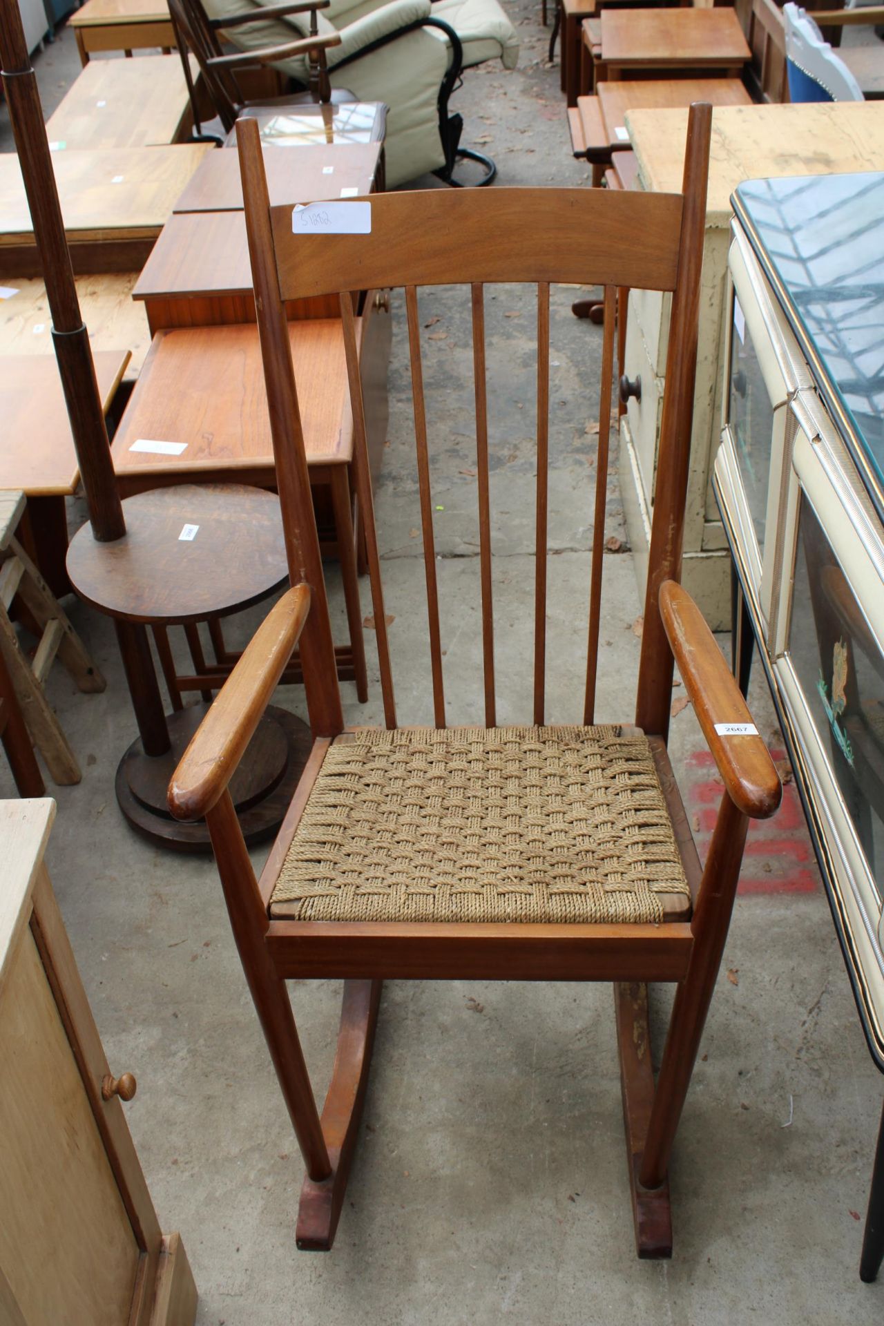A MID 20TH CENTURY HARDWOOD ROCKING CHAIR WITH DROP-IN WOVEN SEAT - Image 2 of 2