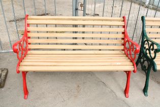 A WOODEN SLATTED GARDEN BENCH WITH DECORATIVE CAST ENDS