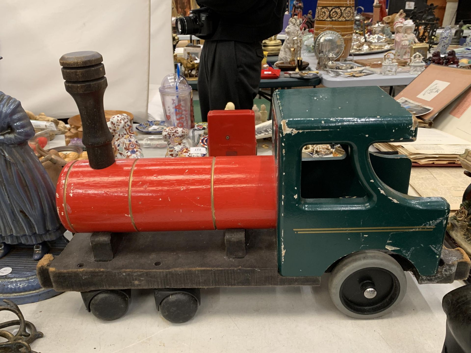 A CHILD'S VINTAGE WOODEN SIT ON CHOO-CHOO