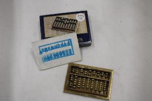 A SMALL VINTAGE HEAVY BRASS ABACUS