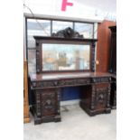 A VICTORIAN OAK BLACK FOREST STYLE MIRROR BACK SIDEBOARD HEAVILY CARVED WITH LION MASK HEAD AND