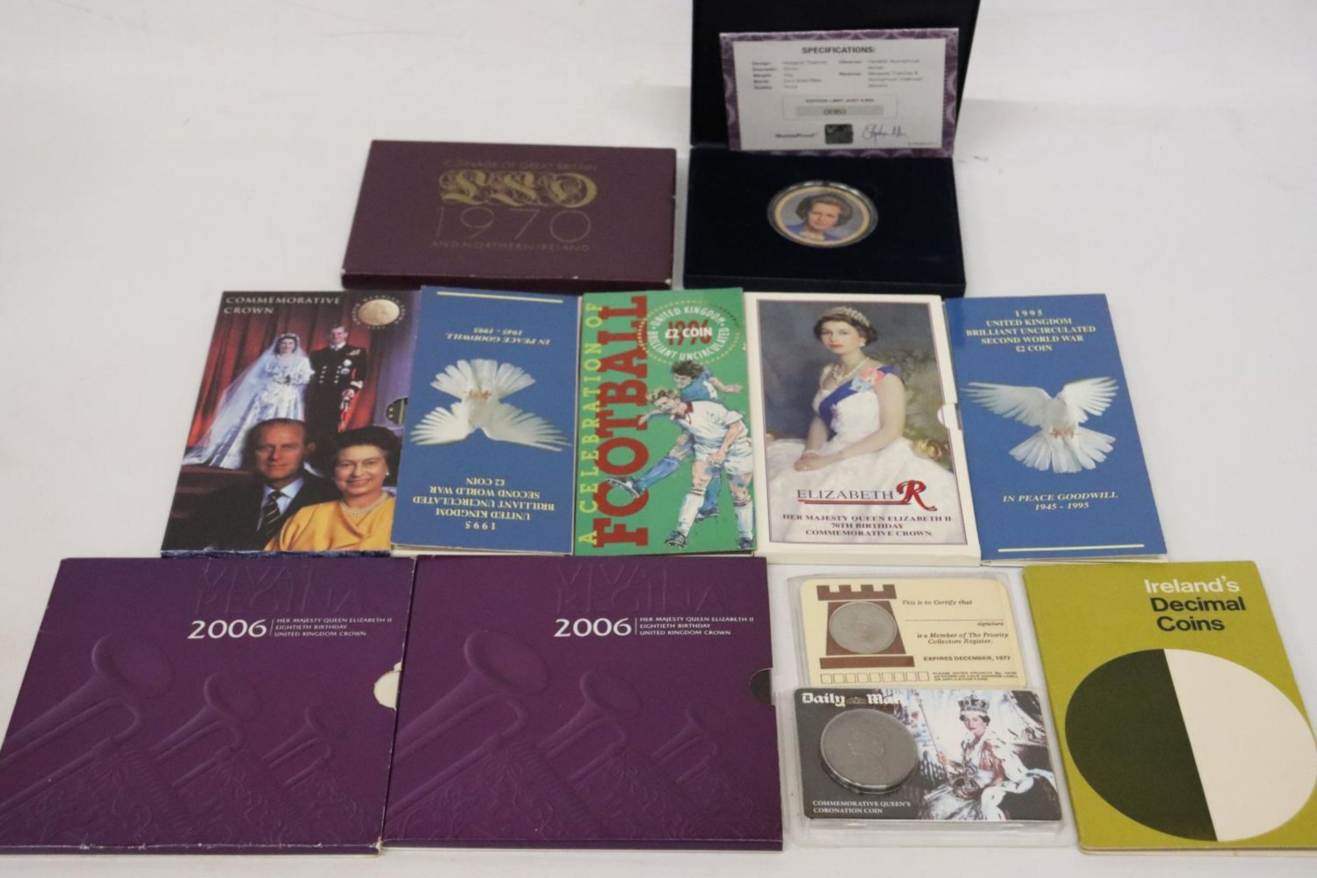A SELECTION OF 7 UK COIN PACKS , 1 X 1970, 1 X ’71, PLUS BOXED MEDALLION OF MARGARET THATCHER