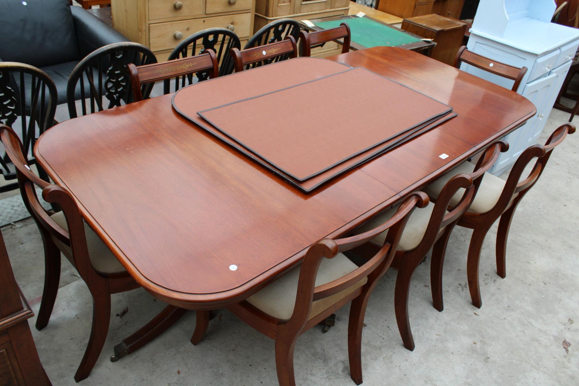 A MAHOGANY REGENCY STYLE EXTENDING TWIN PEDESTAL DINING TABLE 62" X 38" (LEAF 21") AND SIX BRASS - Image 6 of 6
