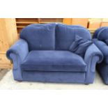 A MODERN BLUE TWO SEATER SETTEE WITH SPRUNG EDGE