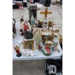 AN ASSORTMENT OF RELIGIOUS ITEMS TO INCLUDE FIGURES AND CANDLES ETC