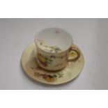 A ROYAL WORCESTER BLUSH IVORY MOUSTACHE CUP AND SAUCER