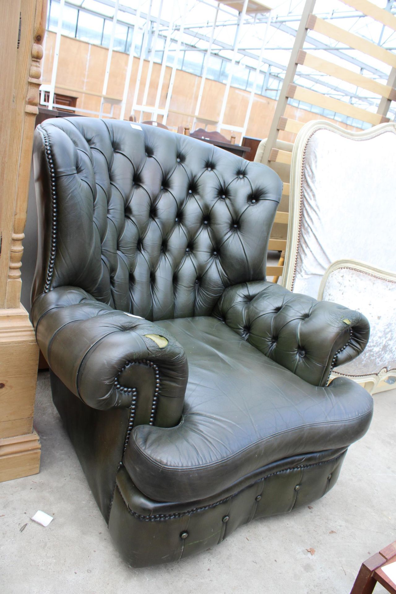 A MODERN GREEN LEATHER BUTTON-BACK WINGED EASY CHAIR - Image 2 of 2
