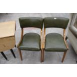 A PAIR OF RETRO DINING CHAIRS WITH GREEN FAUX LEATHER SEATS AND BACKS
