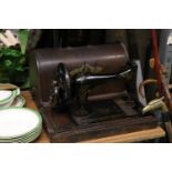 A VINTAGE SINGER SEWING MACHINE IN THE ORIGINAL CASE