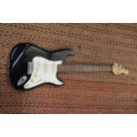 AN ENCORE BLACK STRATOCASTER ELECTRIC GUITAR