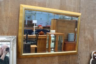 A MODERN GILT FRAMED BEVEL EDGE WALL MIRROR, 33" X 23"