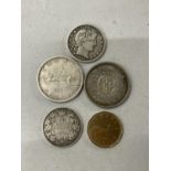 AN 1894 US HALF DOLLAR AND FOUR CANADIAN COINS TO INCLUDE A 1964 AND A 1965 DOLLAR, A 1913 50 CENT
