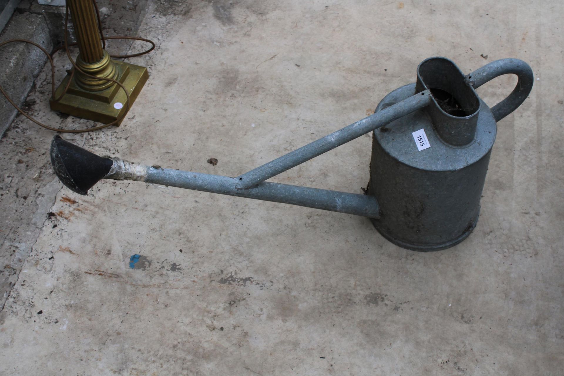 A GALVANISED HAWES LONG SPOUTED WATERING CAN