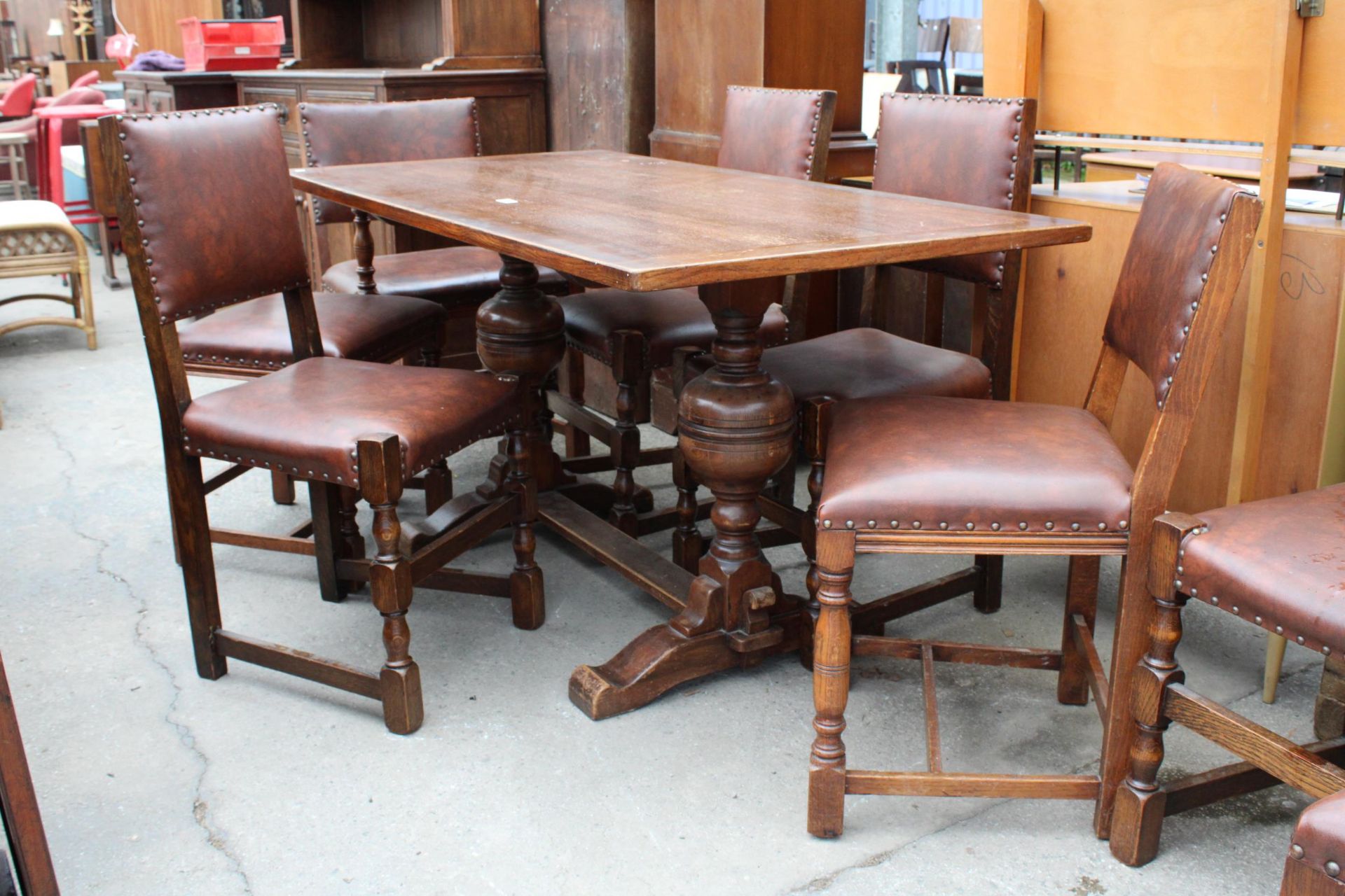 A MID 20TH CENTURY OAK REFECTORY TABLE, 57" X 30" AND NINE STUDDED DINING CHAIRS, ONE BEING A CARVER - Bild 2 aus 6