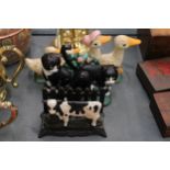 THREE CAST IRON ITEMS TO INCLUDE A LETTER RACK WITH COW DECORATION, PLUS DUCK AND CAT DOOR STOPS