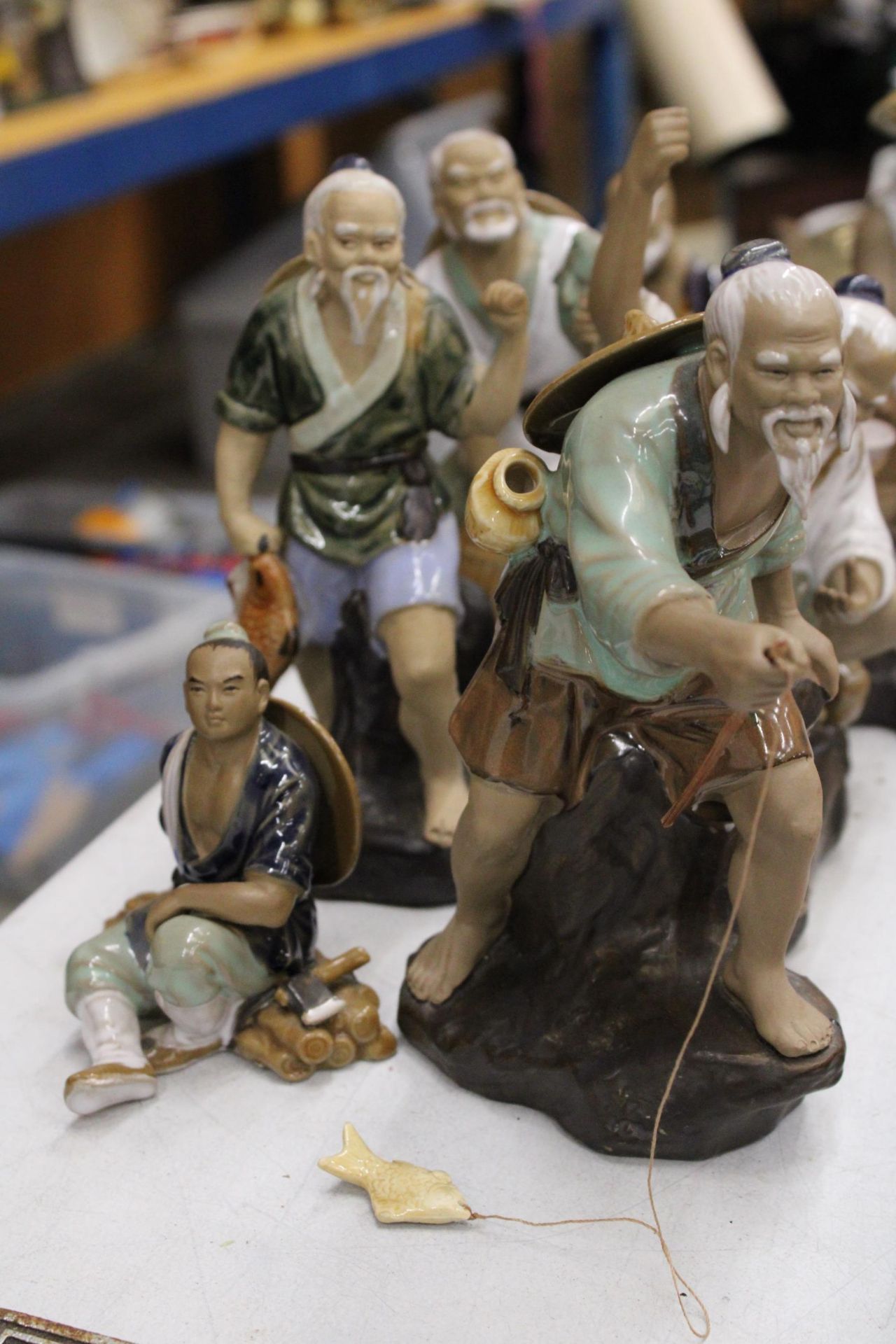 EIGHT FIGURES OF ORIENTAL MUD MEN - Image 3 of 6