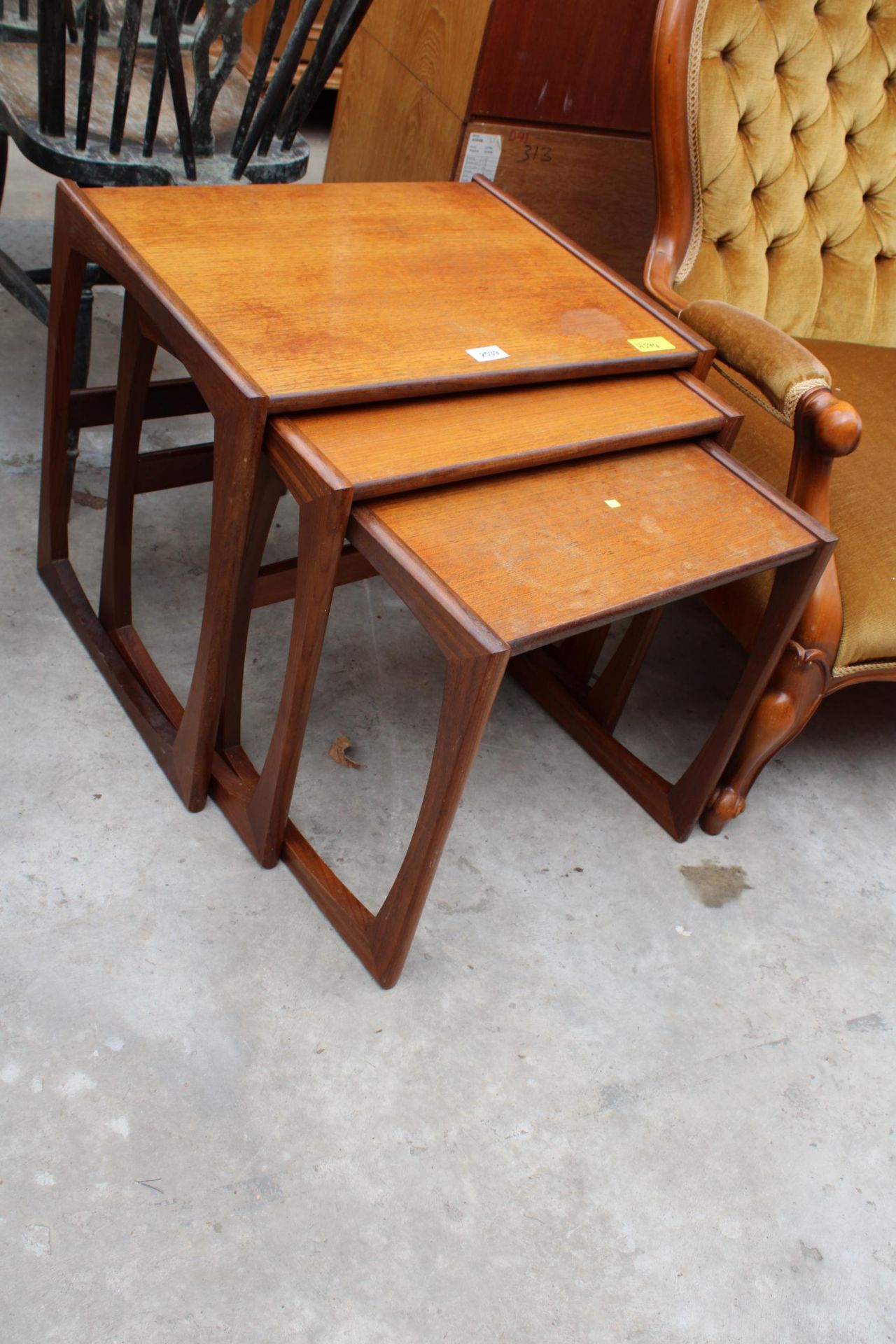 A NEST OF THREE G PLAN TEAK TABLES