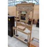 A LATE VICTORIAN CARED OAK MIRRORED HALL COAT/STICK STAND