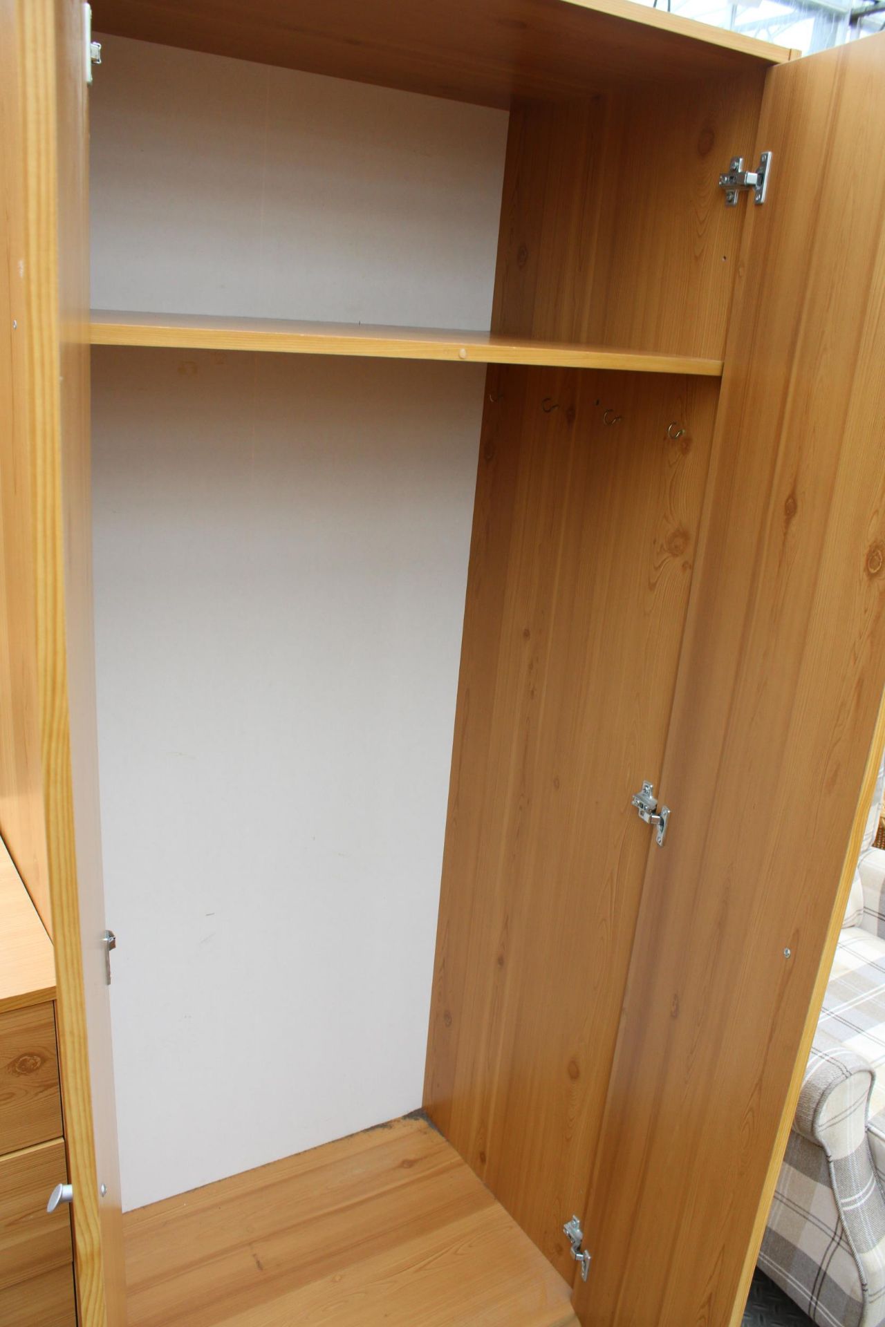 A PINE EFFECT TWO DOOR WARDROBE, CHEST OF FIVE DRAWERS AND A BEDSIDE CHEST - Image 3 of 3