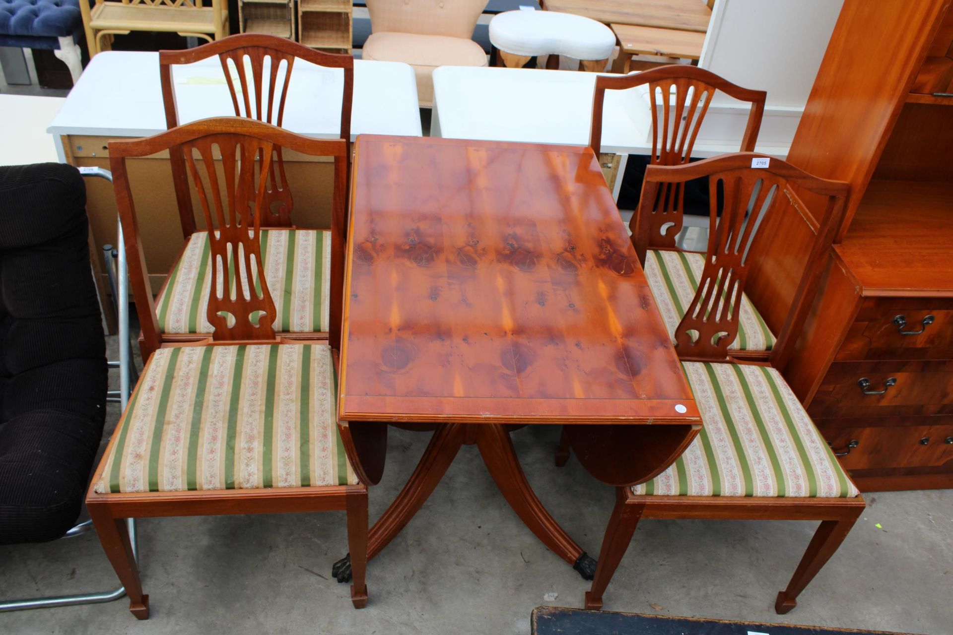 A MODERN YEW WOOD PEDESTAL DROP-LEAF DINING TABLE AND FOUR MATCHING CHAIRS