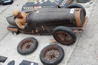 A VINTAGE WOODEN MODEL RACE CAR