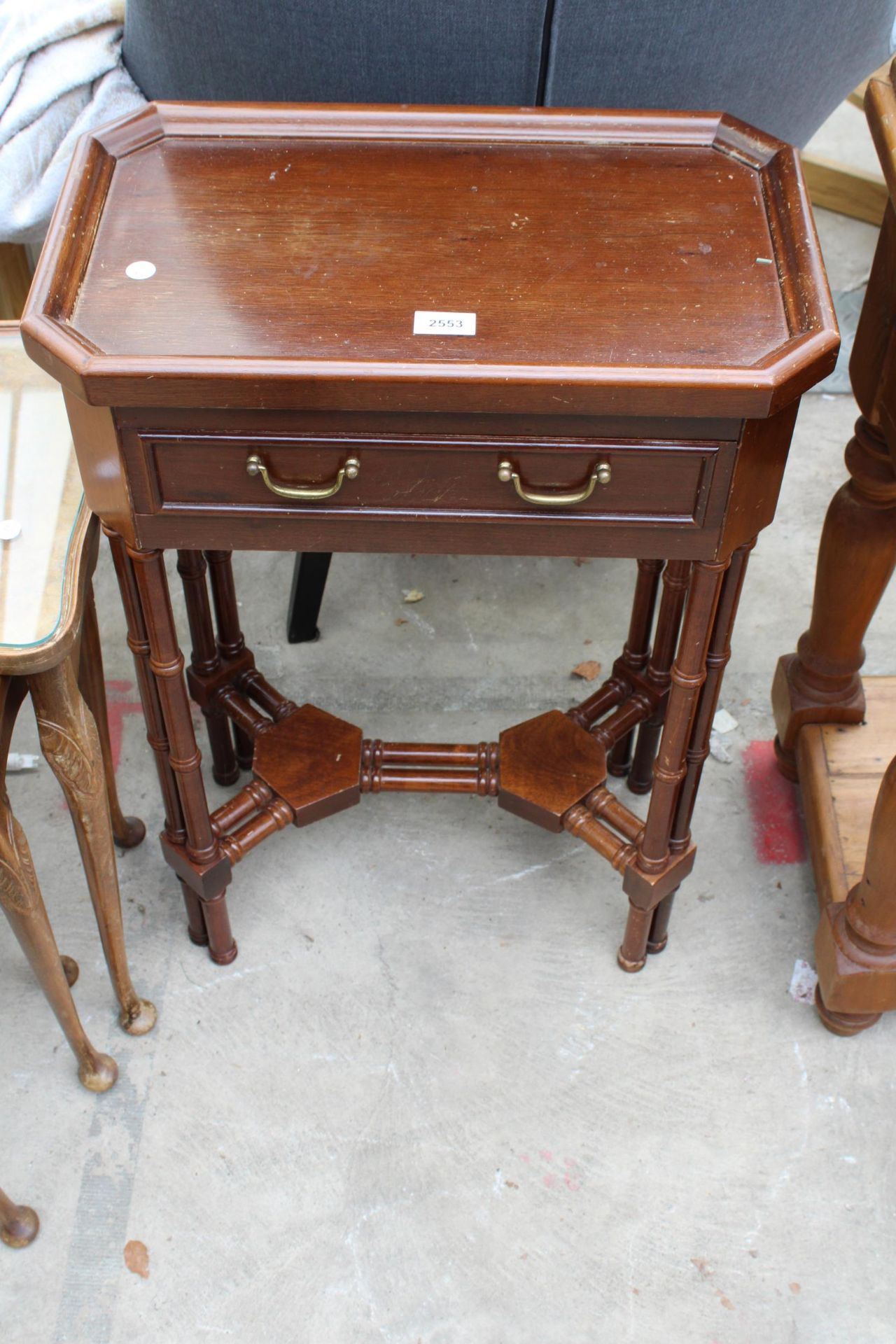 A MAHOGANY SIDE TABLE WITH CANTED CORNERS, SINGLE DRAWER AND MULTIPLE TURNED LEGS AND STRETCHERS