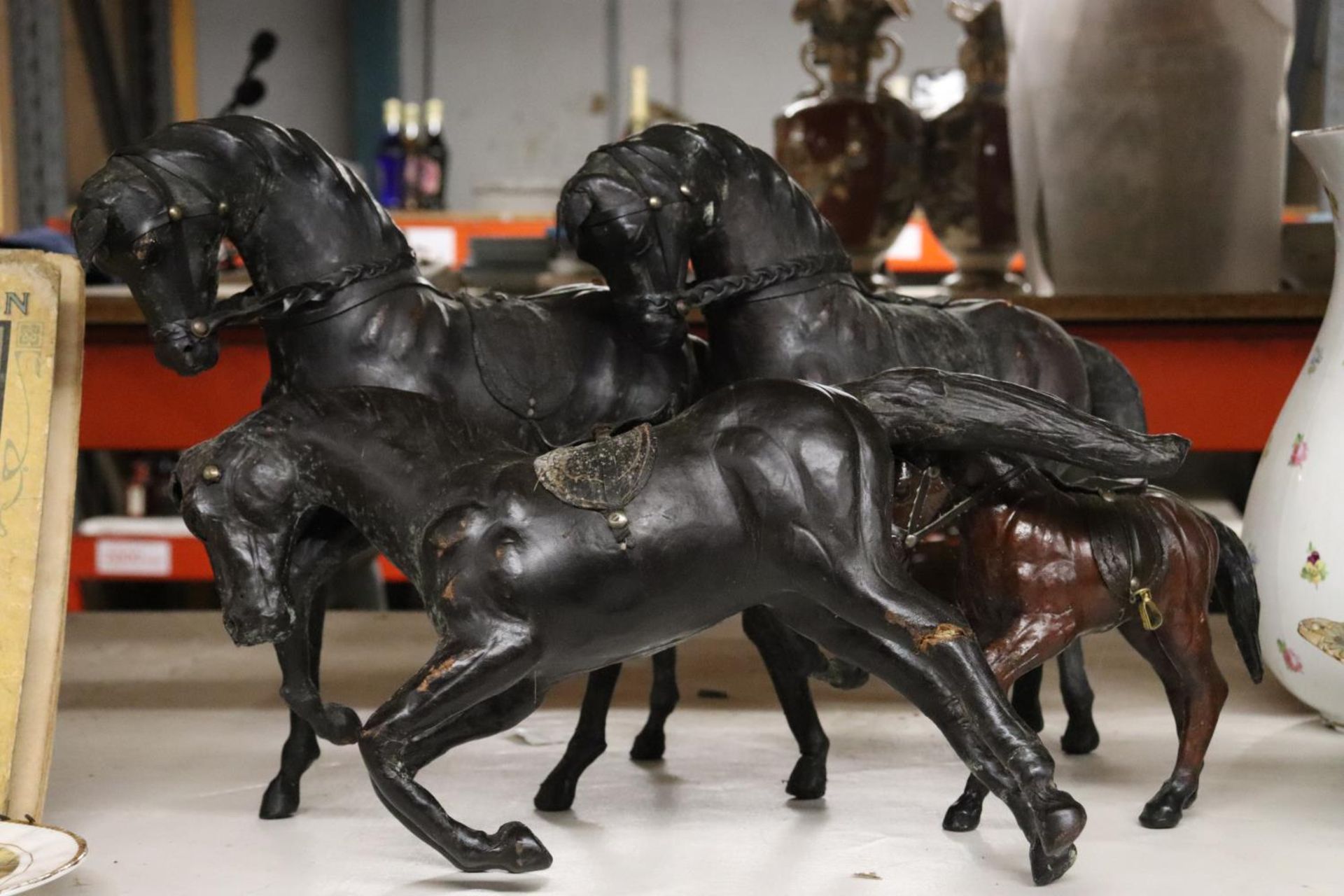 FOUR VINTAGE LEATHER HORSES - 1 A/F