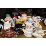 A LARGE COLLECTION OF NOVELTY TEAPOTS