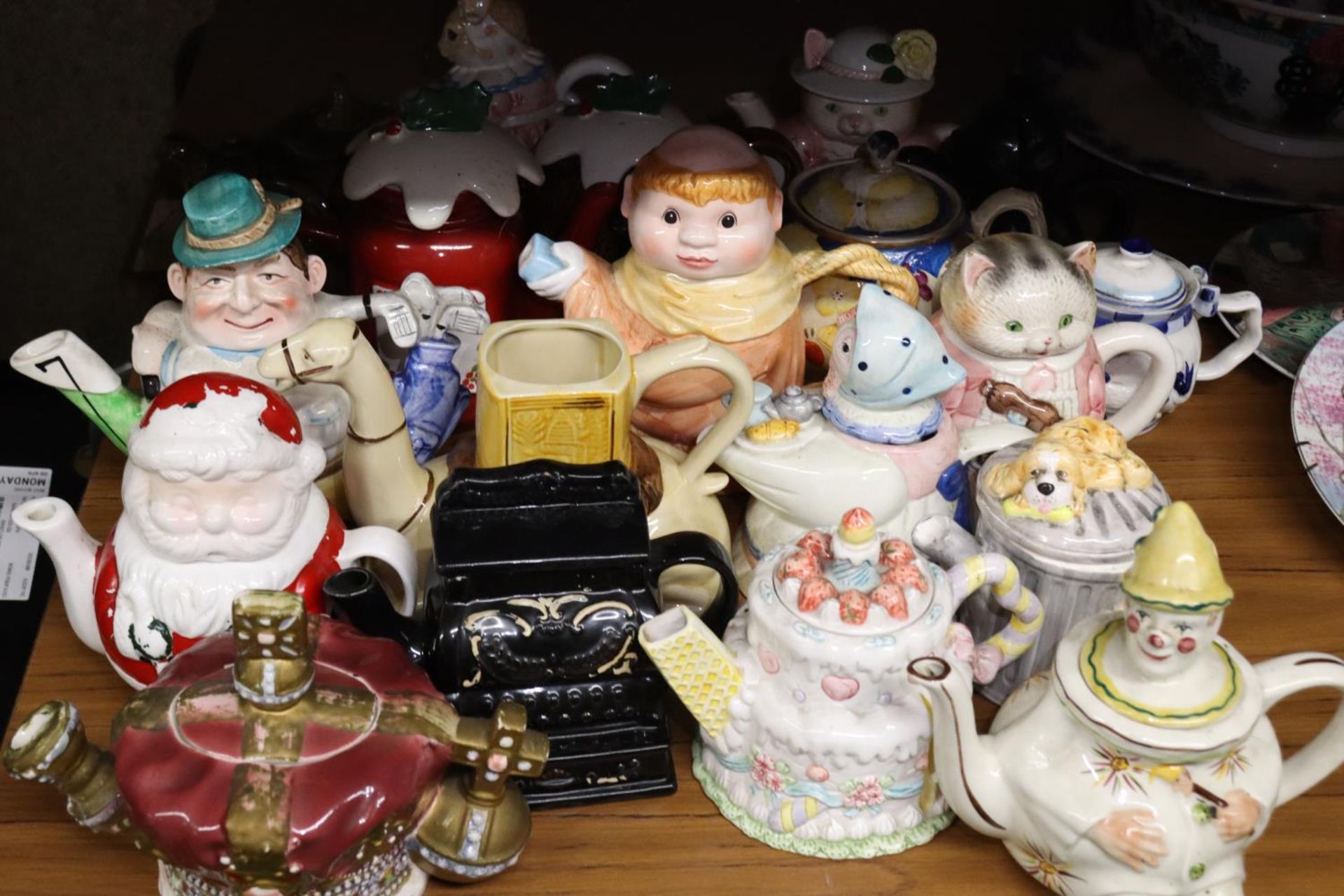 A LARGE COLLECTION OF NOVELTY TEAPOTS