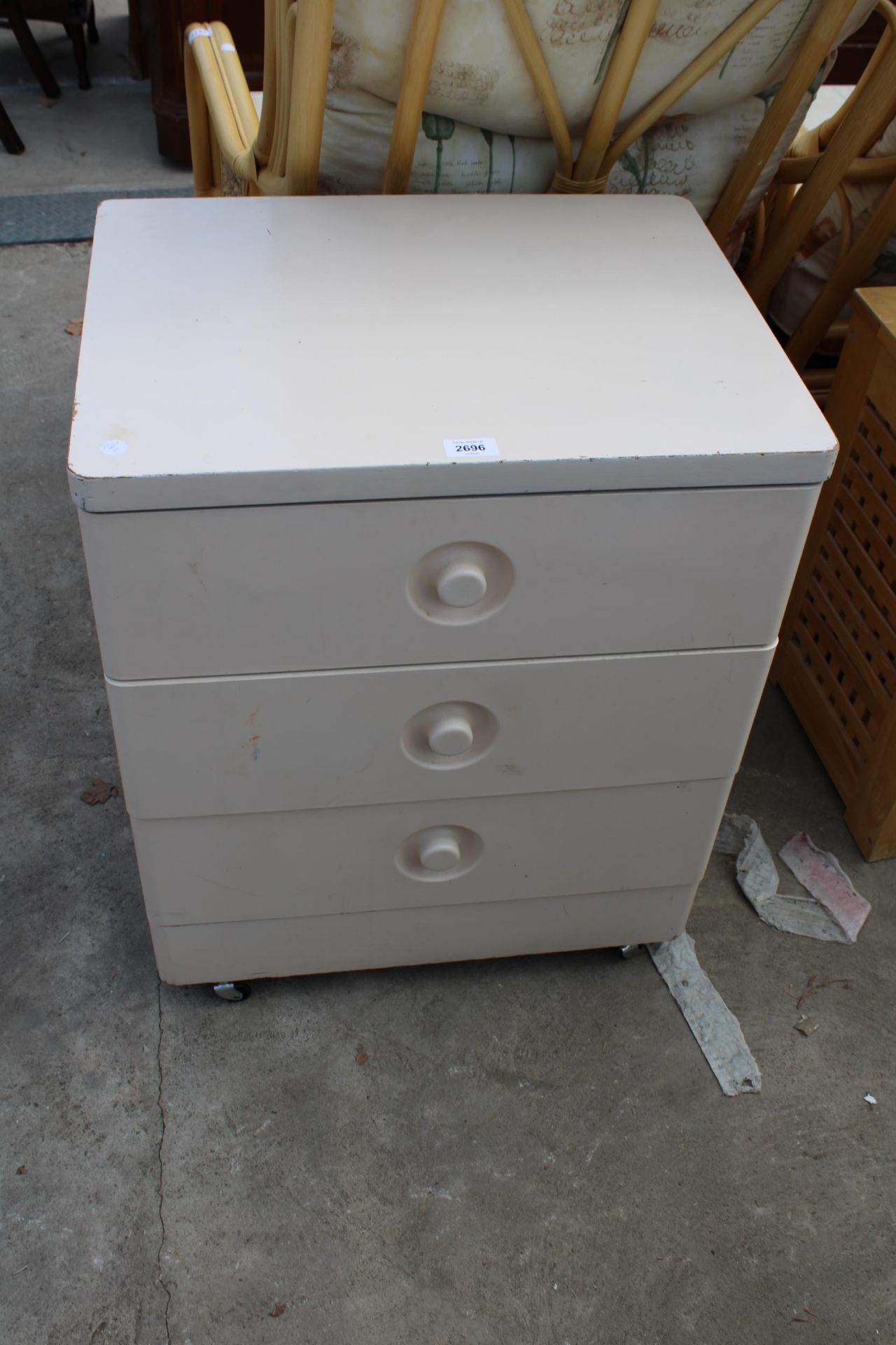 A WHITE PAINTED STAG CHEST OF THREE DRAWERS, 22" WIDE