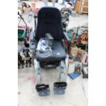 A QUICKIE ELECTRIC WHEEL CHAIR WITH CHARGER, VENDOR STATES GOOD WORKING ORDER, NO WARRANTY GIVEN