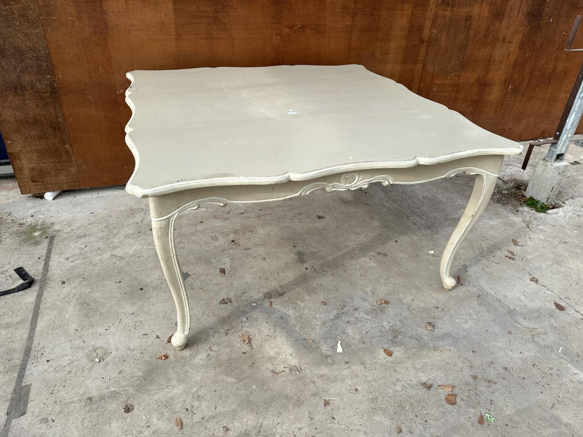 A PAINTED DIALMA BROWN DINING TABLE WITH WAVY RIM 59" SQUARE
